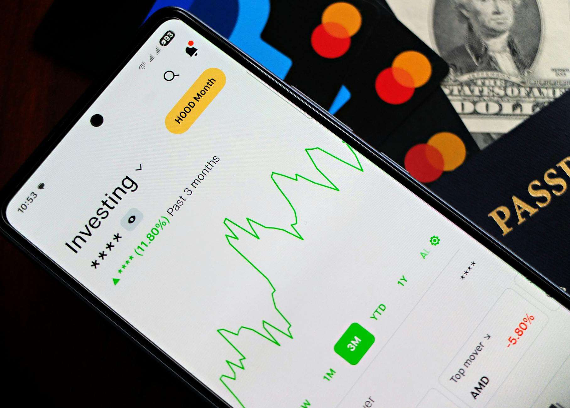 Smartphone screens showing graphs and cryptocurrency portfolio tracking apps.