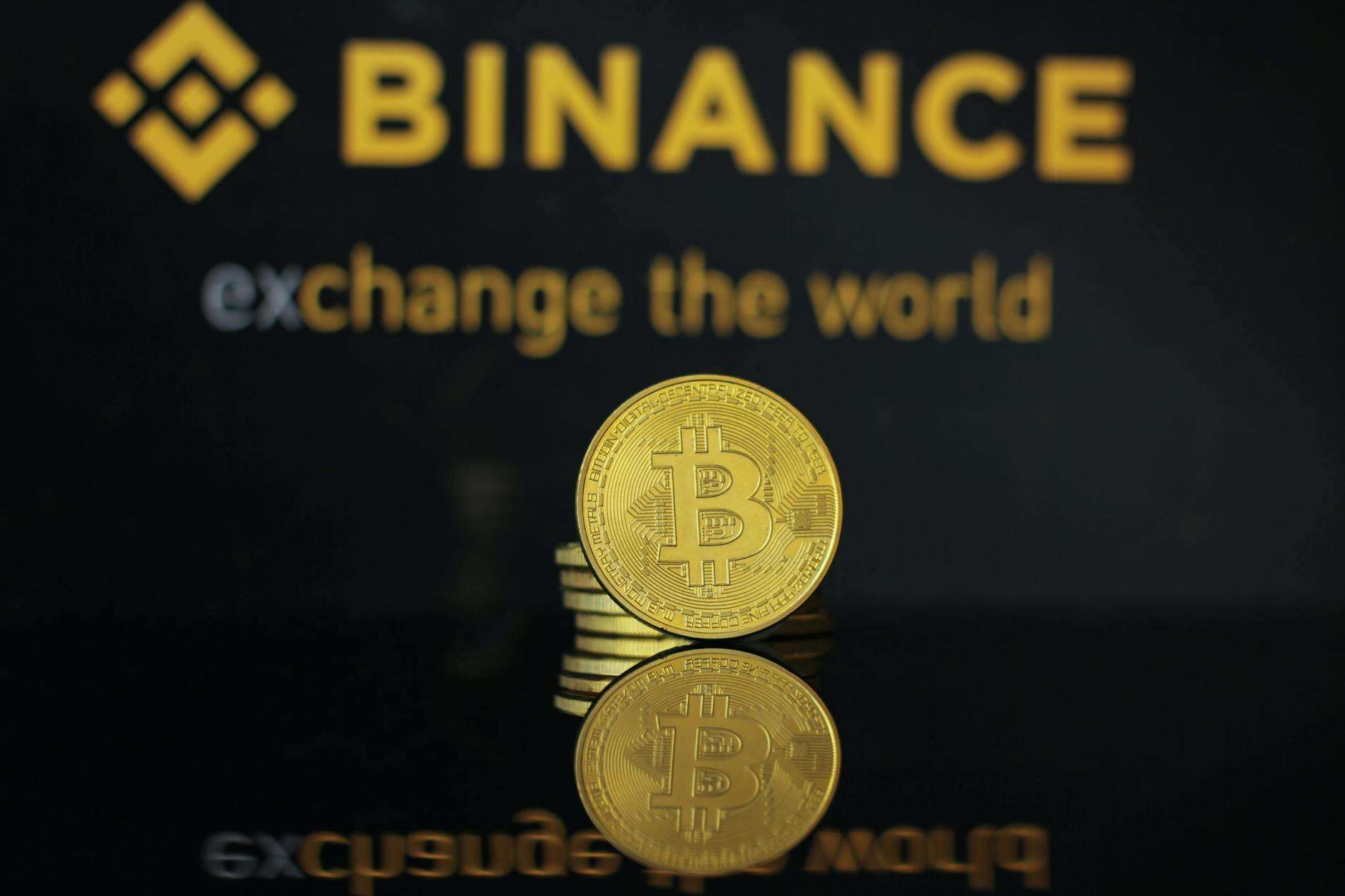 Binance Coin (BNB) logo with abstract crypto background.